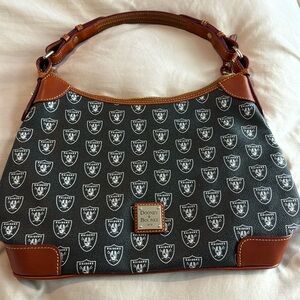 Pre owned NFL Raiders Dooney & Bourke purse
